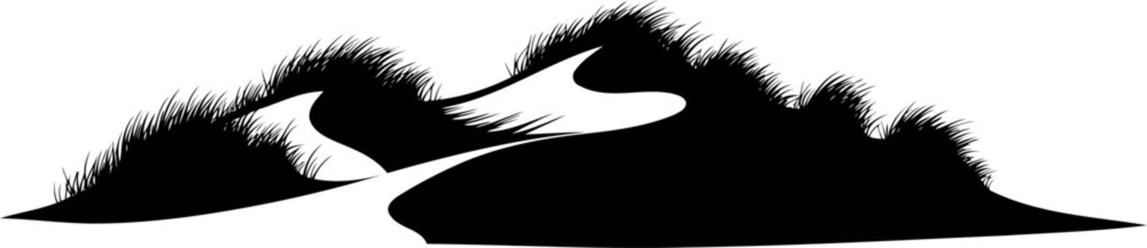 Sand dunes silhouette with beach grass on the ridges