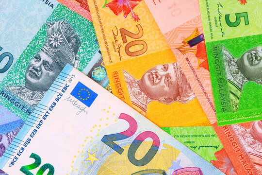 Malaysian ringgit banknotes, Euro cash are together on European cash for identification use.