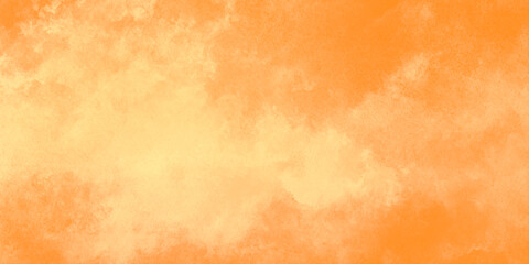 Fototapeta premium Warm orange watercolor background with soft golden textures offering a warm and inviting atmosphere.