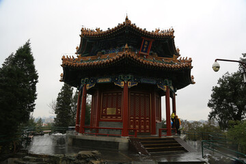 Obraz premium Historic Chinese Pavilion with Golden Roof, Beijing Cityscape View