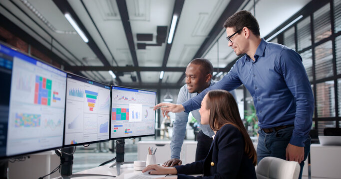 Excited Woman Refreshing Dashboard Celebrates Traffic Spike With Diverse Group
