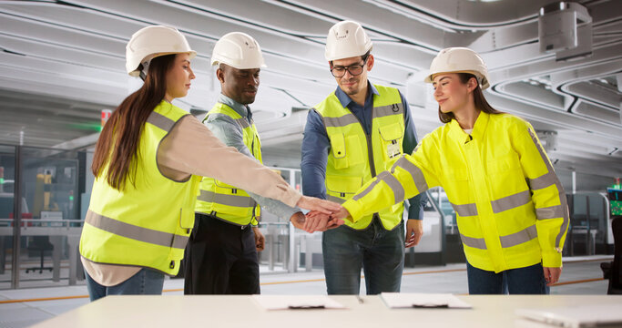 Group Of Workers Collaborating In The Semiconductor Factory