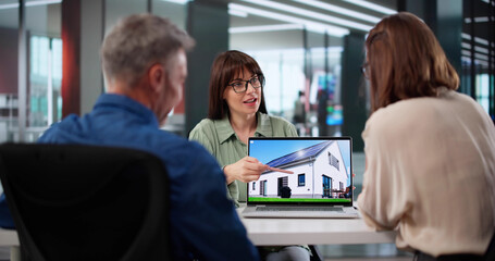 Businessman And Woman In Discussion With Mortgage Agent