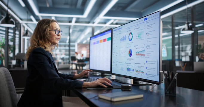 Compliance Officer Monitors Business Security Regulations With Dashboard