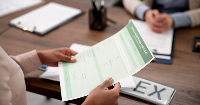 Young African-American Woman Using Laptop To Register Car And Get Plates