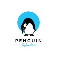Obraz premium Minimalist vector illustration of a penguin against a blue circle, clean animal logo design concept