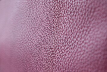 Close-up of burgundy leather texture. Beautiful leather background