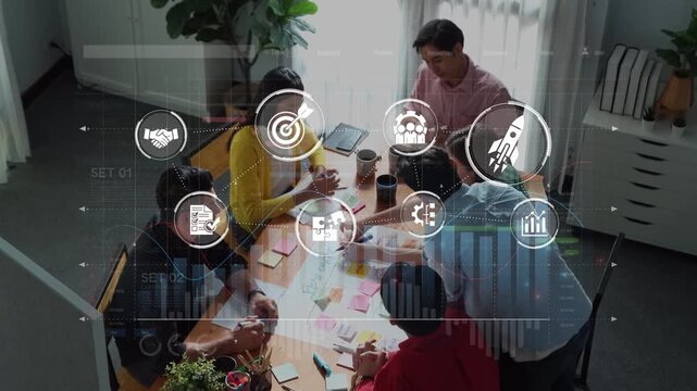 A diverse group of professionals engaged in a collaborative planning session in a modern office, surrounded by digital graphics symbolizing strategy and innovation. Raster