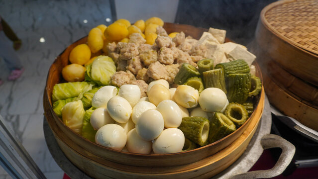 Siomay (also Somai), is an Indonesian steamed fish dumpling with vegetables served in peanut sauce. It is derived from Chinese Shumai. It is considered a light meal that is a type of Chinese Dim Sum.