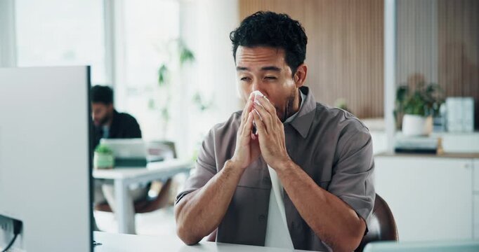 Man, computer and blowing nose in office with tissue, flu and sinus infection at marketing agency. Coworking, sick person and wipe face with toilet paper, virus symptoms and desktop for advertising.