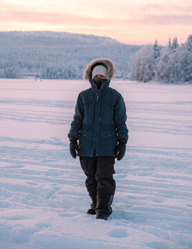 Explore the beauty of Akaslompolo Village in Lapland during a serene winter evening