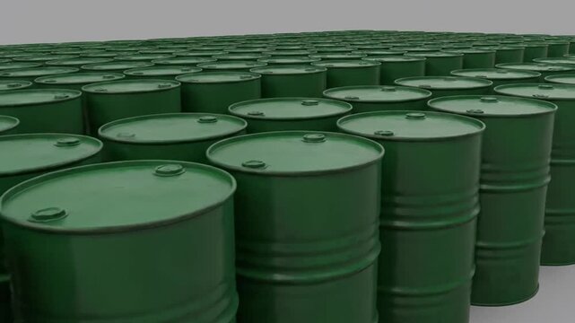 Green industrial barrels stacked in rows on gray background
