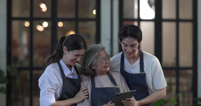 Mother, daughter, and son pose outside their family run ceramic shop and warehouse, presenting a friendly, professional team ready for retail and wholesale customers.
