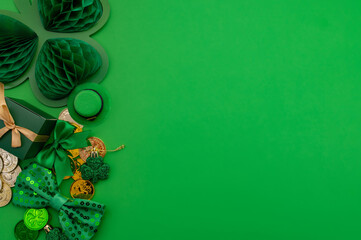 Beautiful table setting for St. Patricks Day celebration on green background