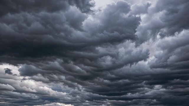 Dramatic and ominous dark storm clouds gathering ominously in the sky, creating a sense of foreboding and intense weather.