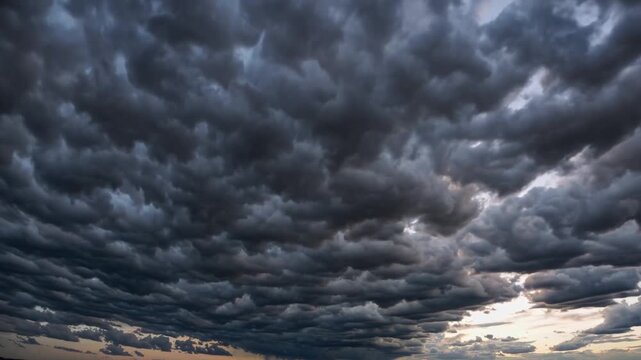 Dramatic and ominous dark storm clouds gathering ominously in the sky, creating a sense of foreboding and impending weather.