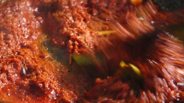 cooking traditional spices in a pan