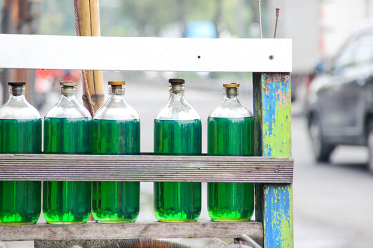 Pertalite type fuel oil (BBM) which is sold retail in glass bottles is sold by street vendors on the roadside