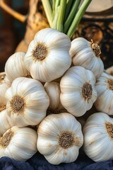 pile of fresh whole garlic bulbs with green stems beside a rustic pot, bright natural light, fresh earthy mood