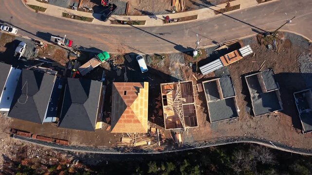 Top View perspective over Beechville: new premium Canadian homes in framing stage. Timber frame structures of expensive houses rising in Nova Scotia winter, Halifax suburb development.