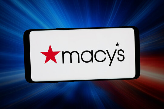 Stuttgart, Germany - 02-16-2026: In this photo illustration, the logo of department store company Macy's Inc. (Macys) is displayed on a smartphone in front of abstract background on computer screen.