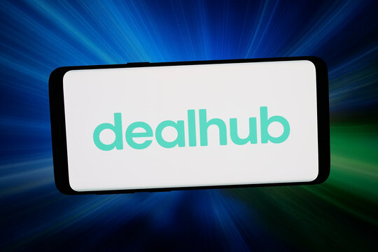 Stuttgart, Germany - 02-16-2026: In this photo illustration, the logo of quote-to-revenue platform company DealHub.io is displayed on a smartphone in front of abstract background on computer screen.
