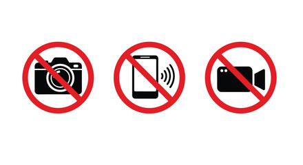 Three universal white square signs with red circles and diagonal lines clearly indicate strict prohibitions against using cameras, mobile phones, and video recording devices in designated areas.