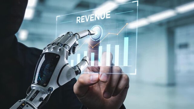 AI monetization timeline -  A human hand and a robotic hand interact with a transparent digital screen displaying a rising revenue graph.