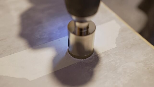 Drilling hole into ceramic tile using core bit
