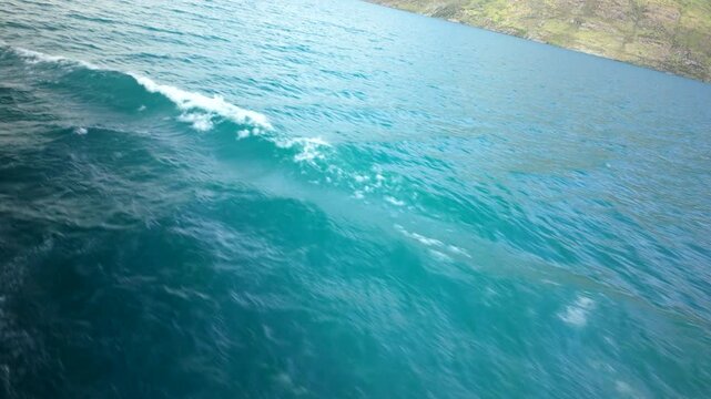Boat Wake On Turquoise Sea Water