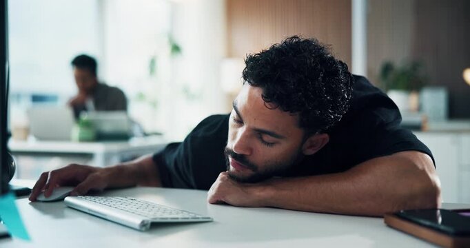 Tired, man and bored with computer in office for editing burnout, mental fatigue and low energy. Coworking agency, exhausted journalist and sleepy at PC from insomnia, tedious article and overworked