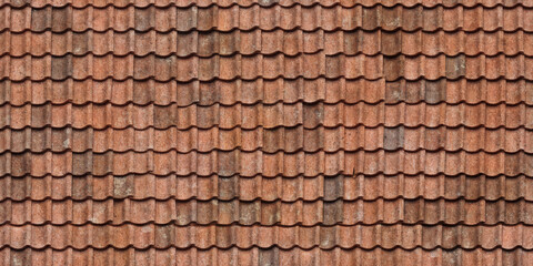 Old red clay roof tiles forming a textured architectural pattern background © Jnanesh