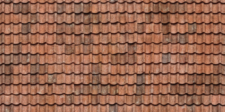 Old red clay roof tiles forming a textured architectural pattern background