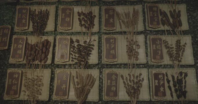 Chengdu, Sichuan, China. Ungraded C LOG 2, Insects on sticks at local Chinese market. Various cooked insects thread on skewers. New Source Of Protein, Lipids, Minerals, And Vitamins. Fried Insects