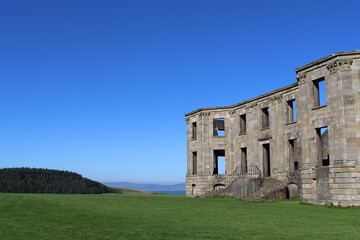 Fototapeta premium Empty shell of an abandoned stone mansion house