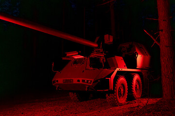 self-propelled artillery mount Suzanne in the forest. Military vehicle at night
