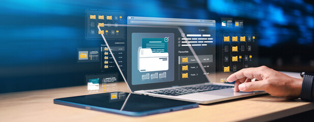 Business user managing digital files on laptop with virtual folder interface and cloud document...
