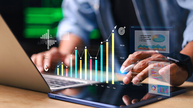Business analyzing financial data on tablet and laptop with digital charts and growth graph interface. Concept of business analytics, KPI monitoring, investment growth and performance reporting.