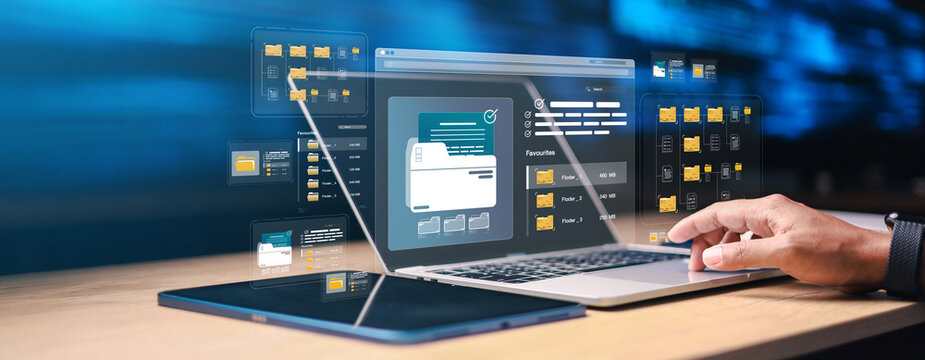 Business user managing digital files on laptop with virtual folder interface and cloud document system. Concept of data organization, file storage, document management and workflow technology.