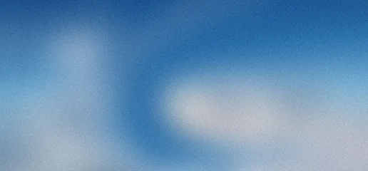 Soft blue sky background with subtle white clouds and a gentle gradient, creating a serene and airy atmosphere with a slight grain texture. © MASUM.ME