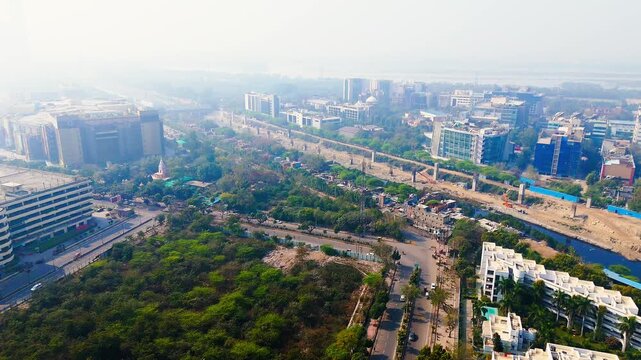 Modern Architecture in Sector 18 Noida India: Aerial View of the Building and City Skyline at Haze. Top down Buildings and Apartment with Multiple Building aerial.