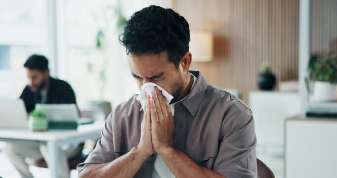 Sick, man and blowing nose in office with tissue, congestion and sinus infection at marketing agency. Coworking, person and allergy in advertising company with toilet paper, virus symptoms and germs.