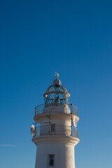 Mediterranean Lighthouse Against Deep Blue Sky with Copy Space
