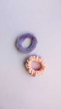 Scrunchie for hair isolated on violet background