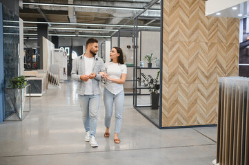Couple shopping for floor tiles interior design