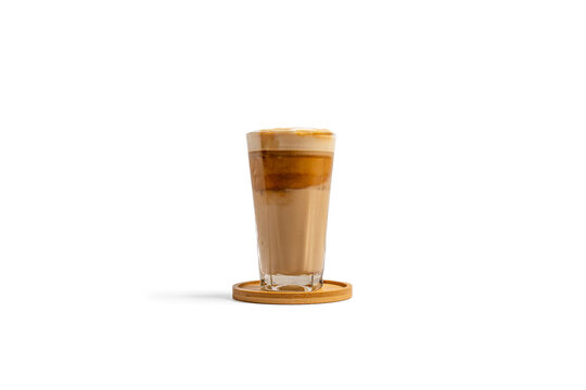 Iced latte coffee with layered espresso and milk foam in tall glass isolated on white background, front view. Minimal studio image for cafe menus, beverage branding, social ads 