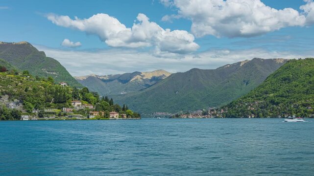 Time lapse, A deep glacial lake ringed by steep, wooded hills and picturesque villages, Lake Como, Lombardy, Italy.