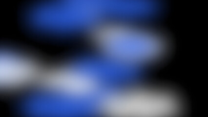 A blurry image with blue and white shapes on a black background