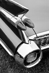 Black and white close up of the iconic tail fins and twin bullet taillights of a 1959 Cadillac © Philip