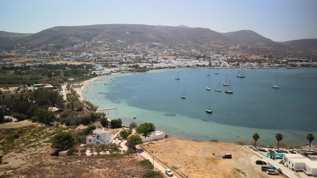 Aerial images of Paralia parikia beach on the island of Paros, Greece, during a sunny summer day, 1-inch sensor 4k 30fps